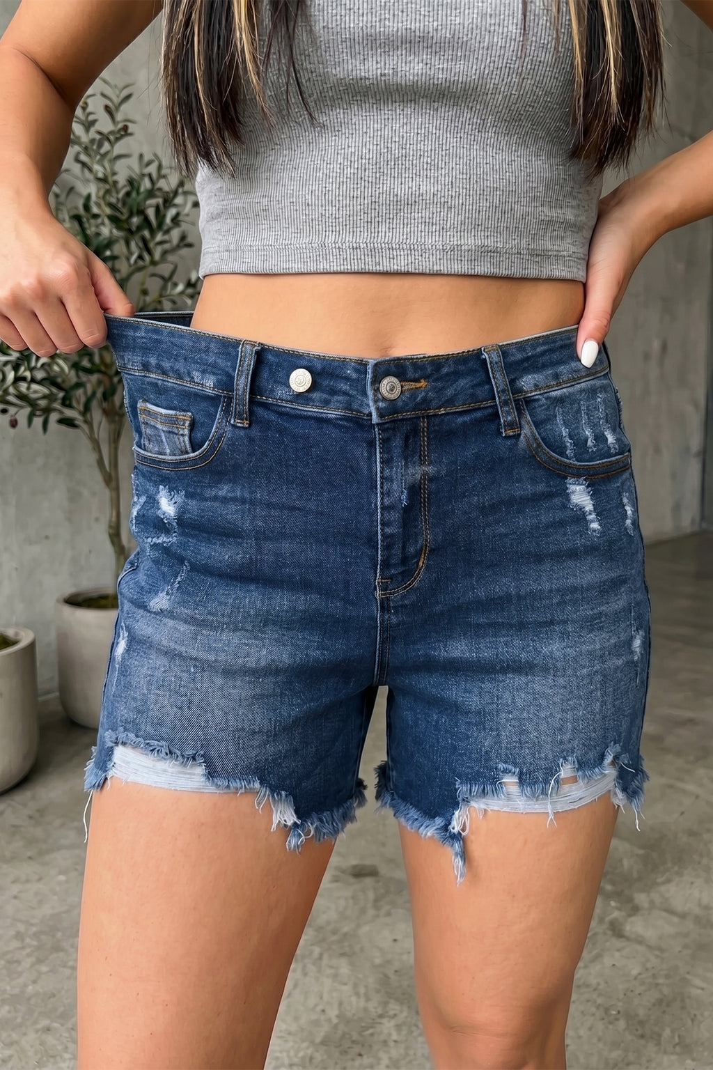 Distressed Whiskery Denim Shorts With Asymmetric Raw Hem