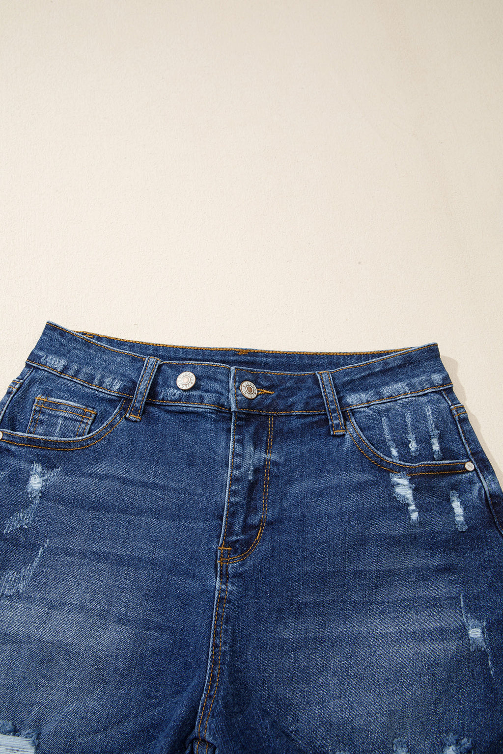 Distressed Whiskery Denim Shorts With Asymmetric Raw Hem