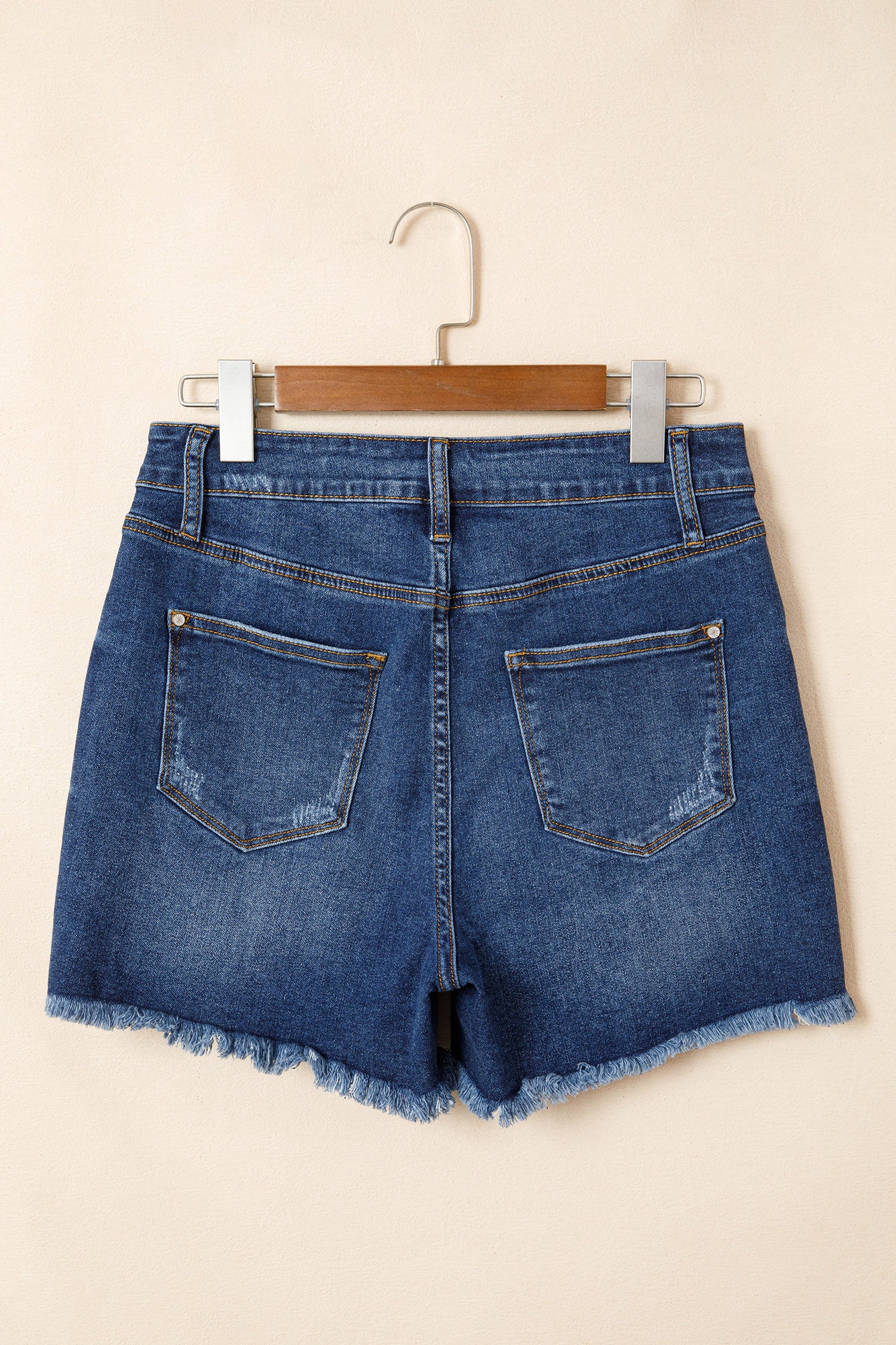 Distressed Whiskery Denim Shorts With Asymmetric Raw Hem